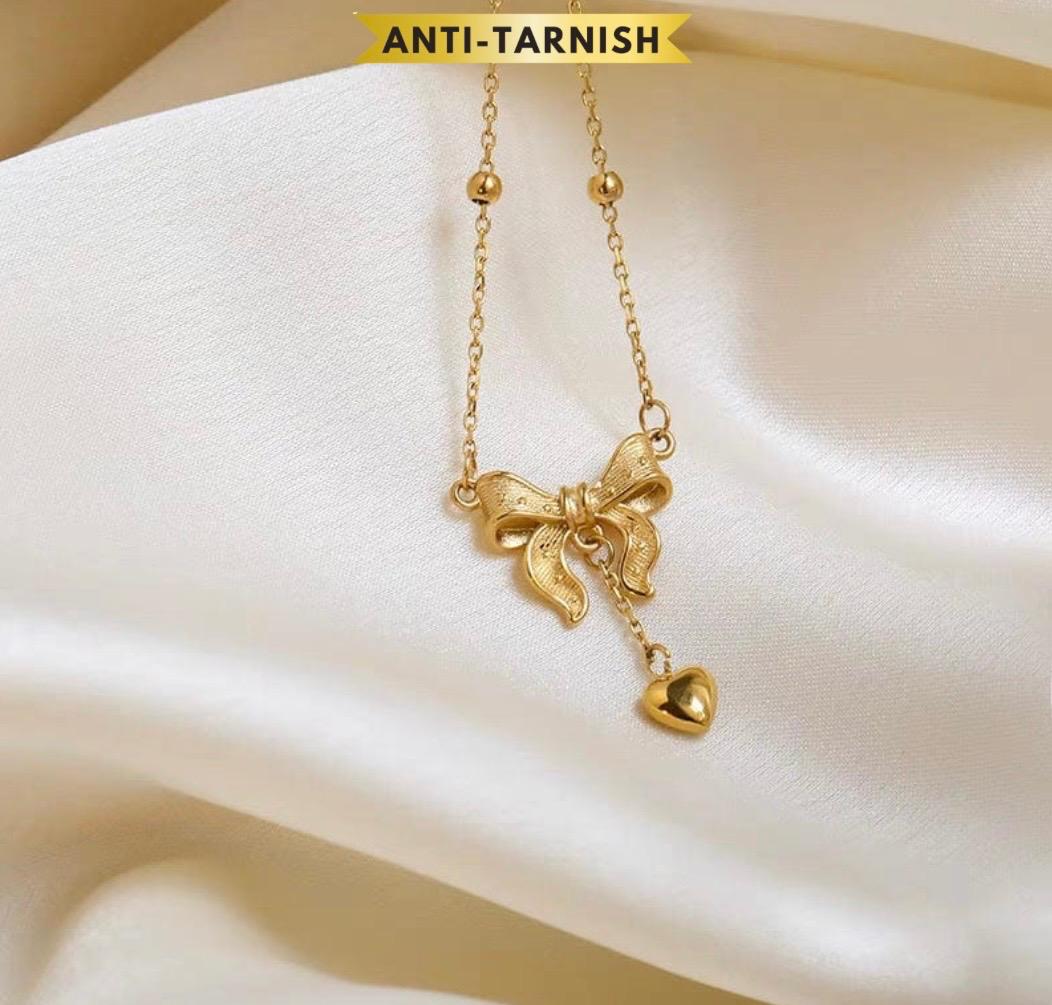 BOW KNOT HEART TASSEL NECKLACE