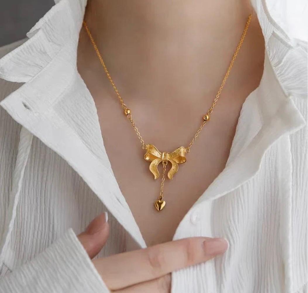 BOW KNOT HEART TASSEL NECKLACE