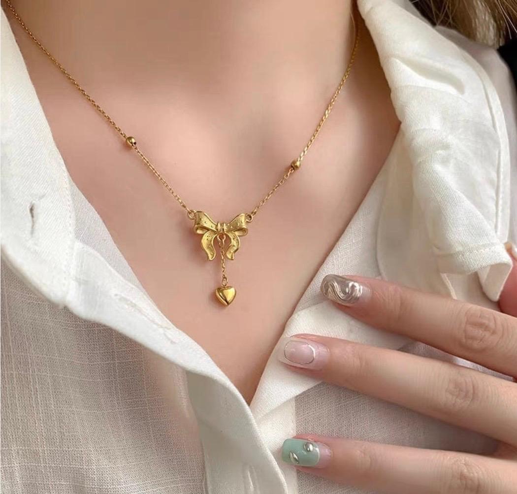 BOW KNOT HEART TASSEL NECKLACE